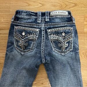 Rock Revival Distressed Blue Jeans with Embroidered Pockets